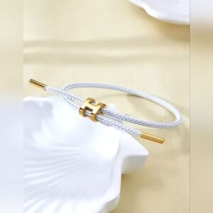 White Braided Bracelet with Gold “H” Charm